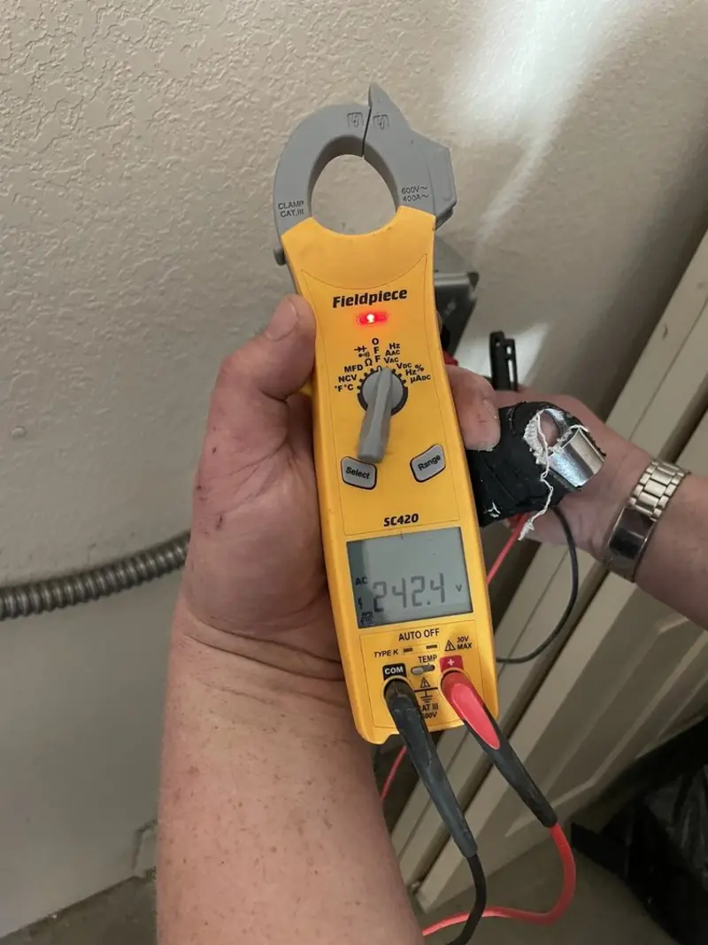 Voltage testing with clamp meter during Ceiling Fan Installation in Walnut Ridge